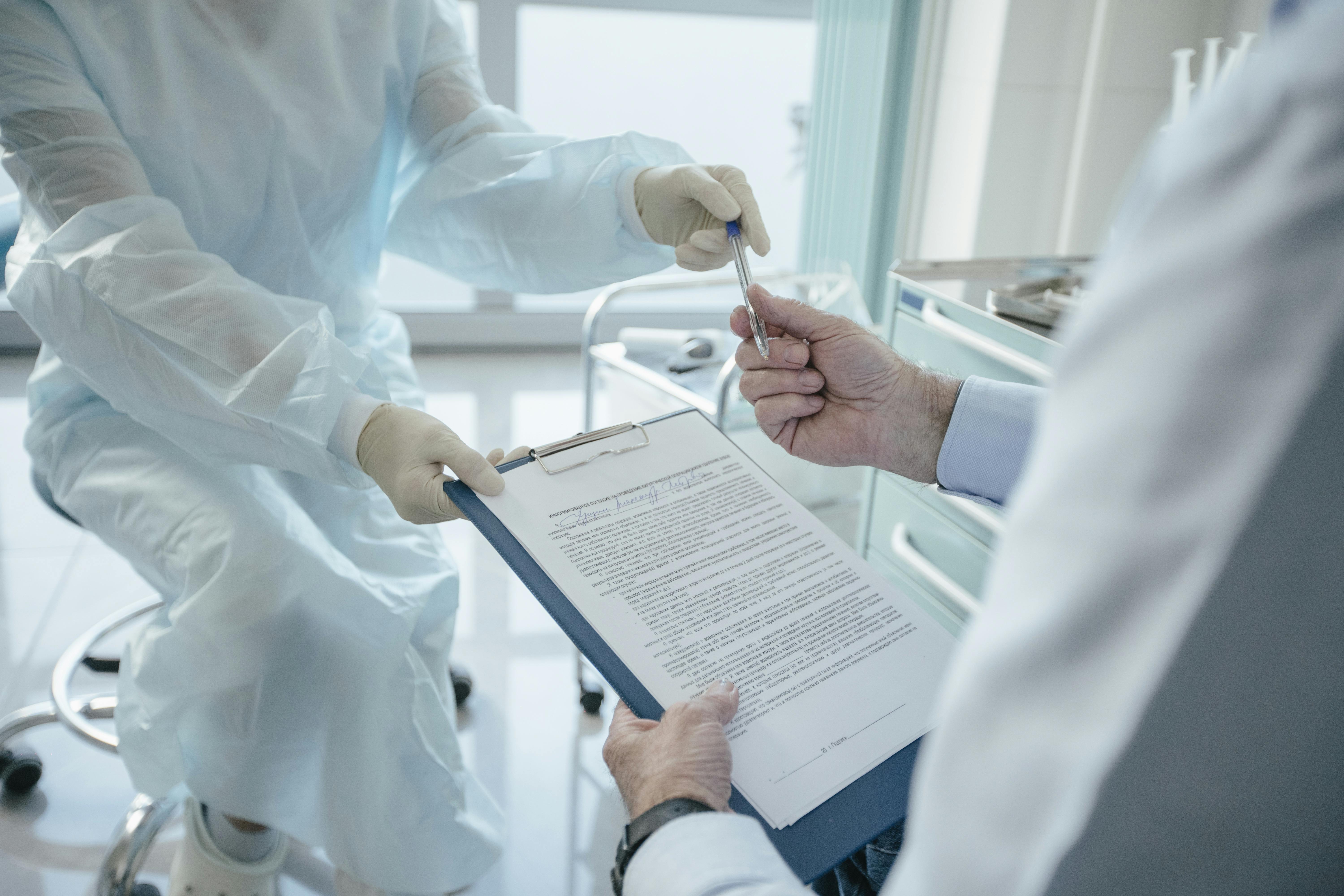 Clinicians reviewing diagnostic paperwork